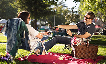 Two people enjoying Highwayman Trailblazer at a picnic