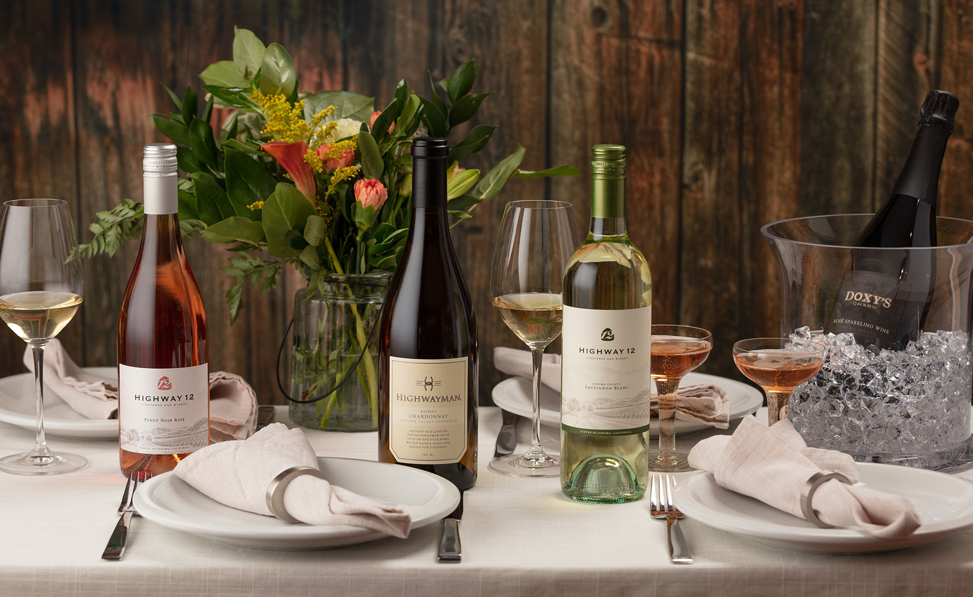 Spring themed table setting photo with Highway 12 Rose, Sauvignon Blanc and Highwayman Chardonnay