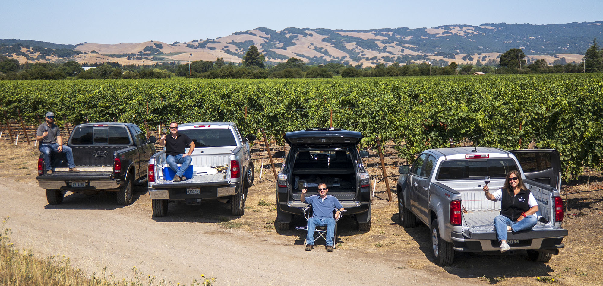 Highway 12 Team Toasting in the vineyard