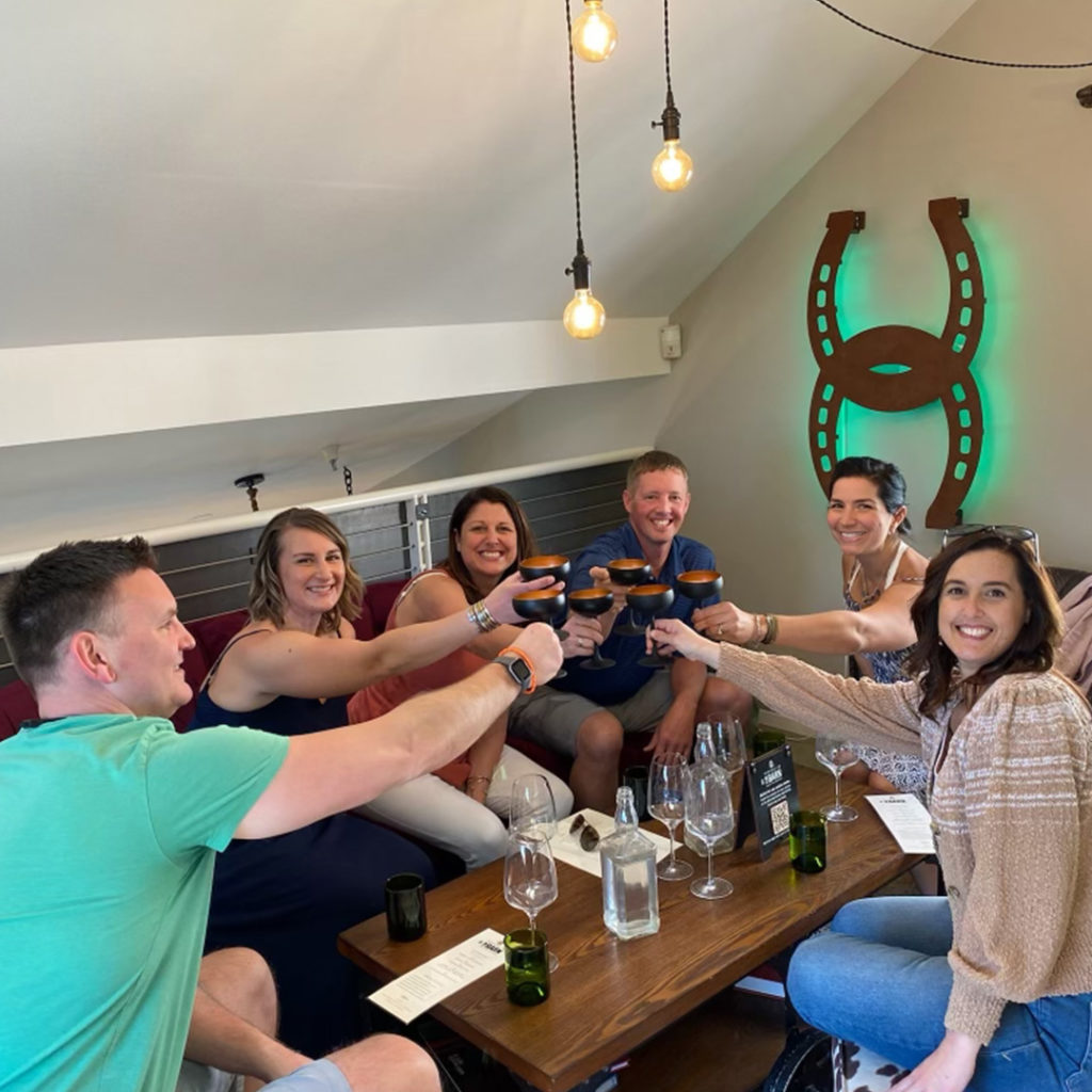 HIghway 12 customers toasting in the tasting room loft