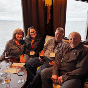 group of guests enjoying wine in the lounge